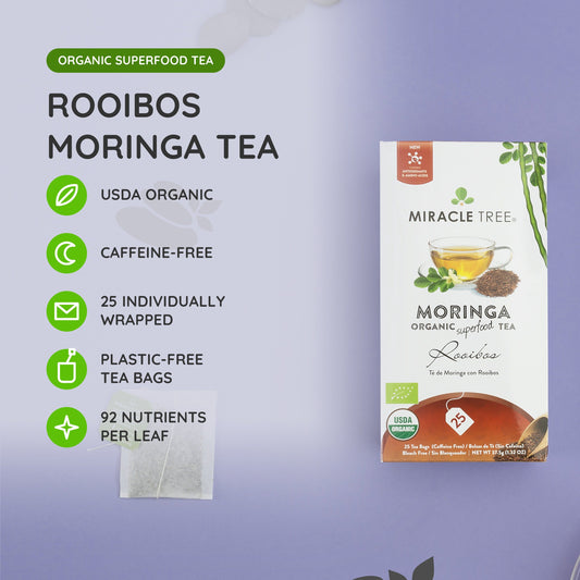 Organic Moringa and Rooibos herbal tea from Miracle Tree, caffeine-free loose leaf tea with vibrant tea leaves in a clear cup.