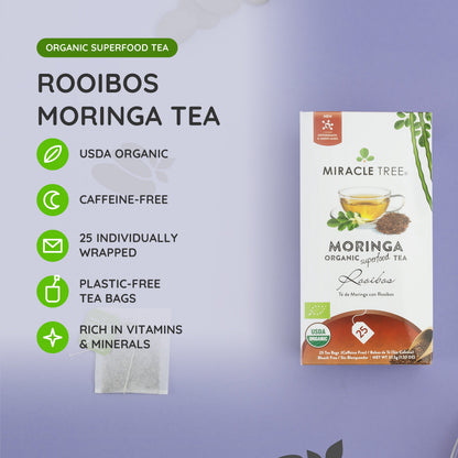 Cup of Miracle Tree organic Moringa Rooibos herbal tea in a clear glass mug, showcasing its reddish-brown color and herbal infusion.