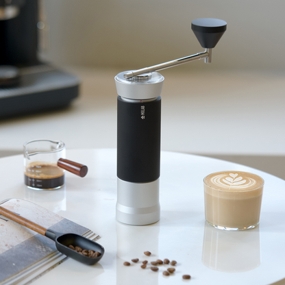 Timemore X Millab M01 coffee grinder with stainless steel body and ceramic burrs, designed for home brewing.