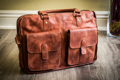 Black Kiko commuter briefcase bag with handle and shoulder strap, featuring multiple compartments and a sleek professional design.