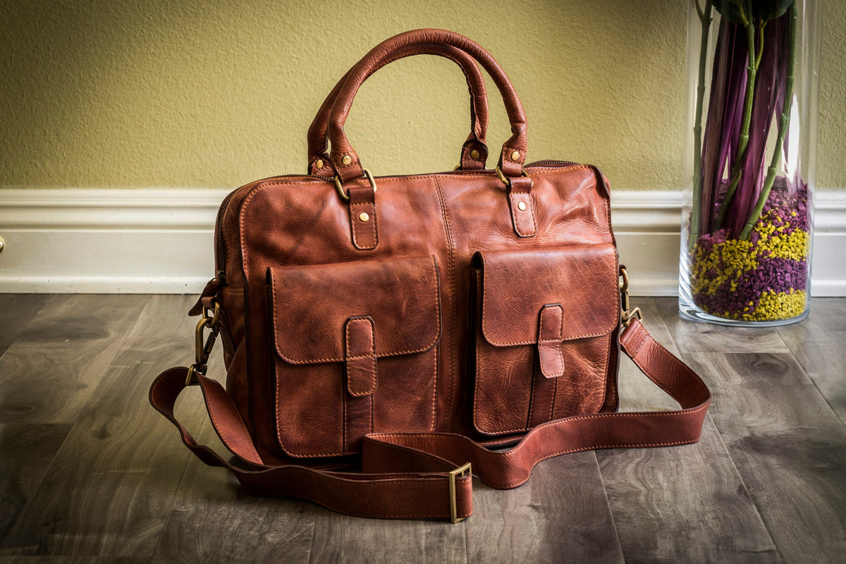 Kiko commuter briefcase made of durable bags material, featuring a sleek design with handles and a shoulder strap for versatile carrying.