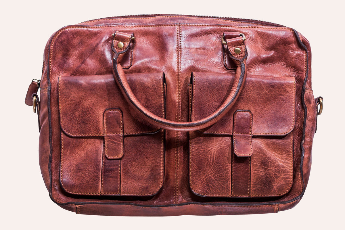 Kiko commuter briefcase made of durable bags material, featuring a sleek design with handles and a shoulder strap for versatile carrying.