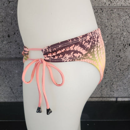 Loco Boutique bandana with keyhole gather design, featuring vibrant patterns and soft fabric, displayed flat on a white background.