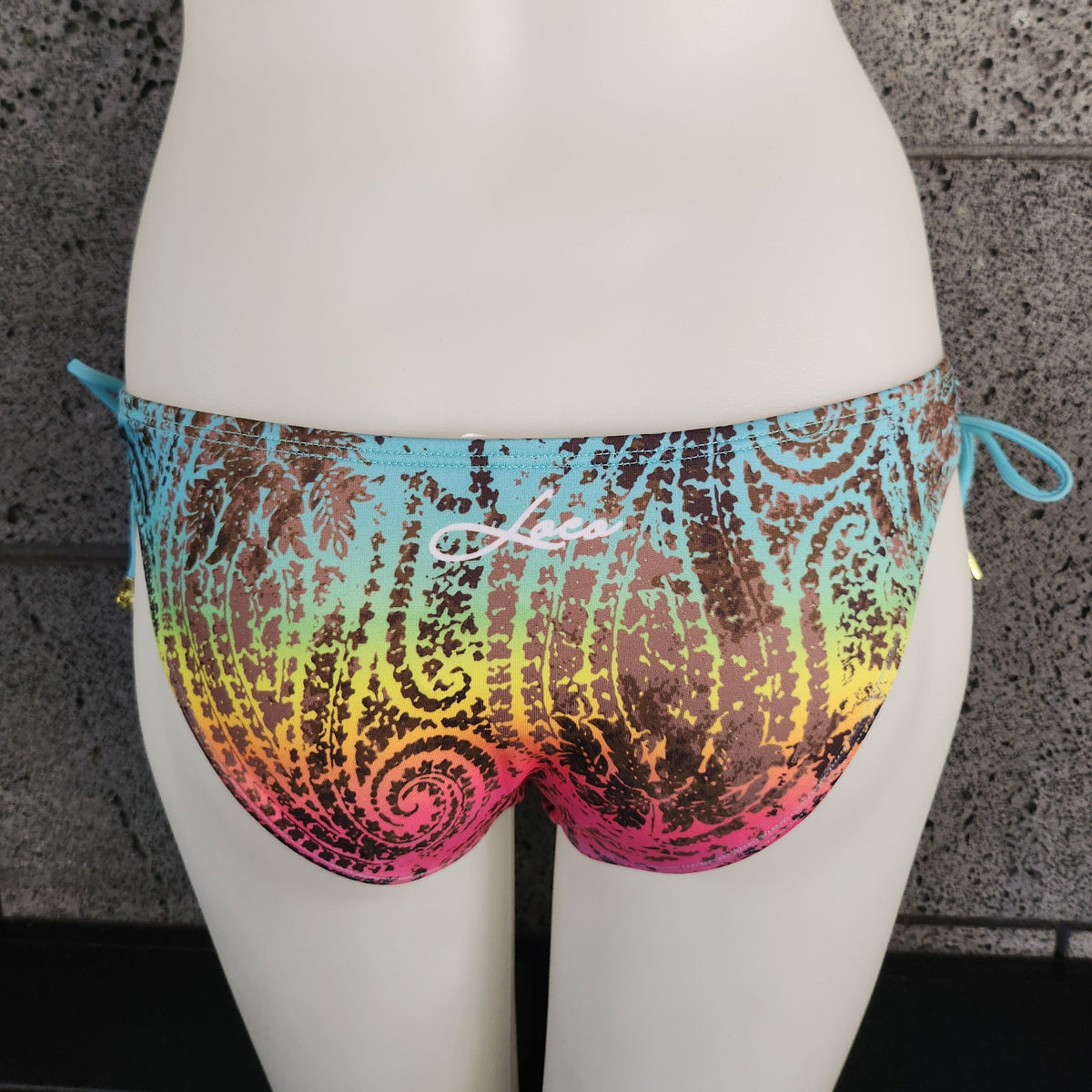 Loco Boutique bandana with keyhole gather design, featuring colorful fabric and stylish detailing.