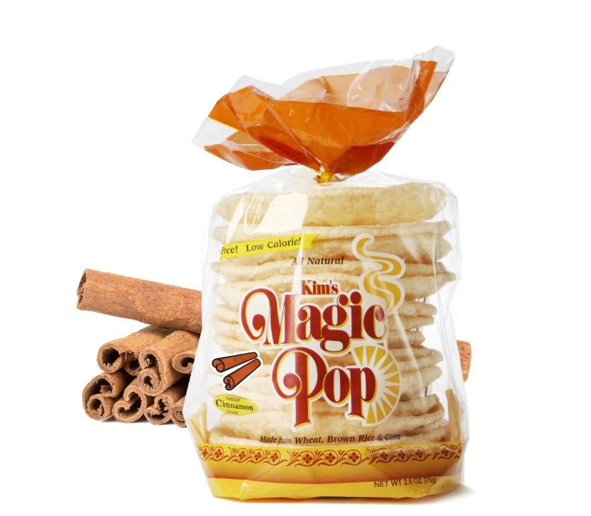 Kim's Magic Pop cinnamon-flavored snack, Delice Products, in a clear package with visible popcorn pieces and cinnamon seasoning.