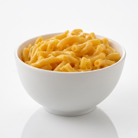 Creamy bowl of AmBari Nutrition macaroni and cheese with cooked pasta and melted cheese on top.