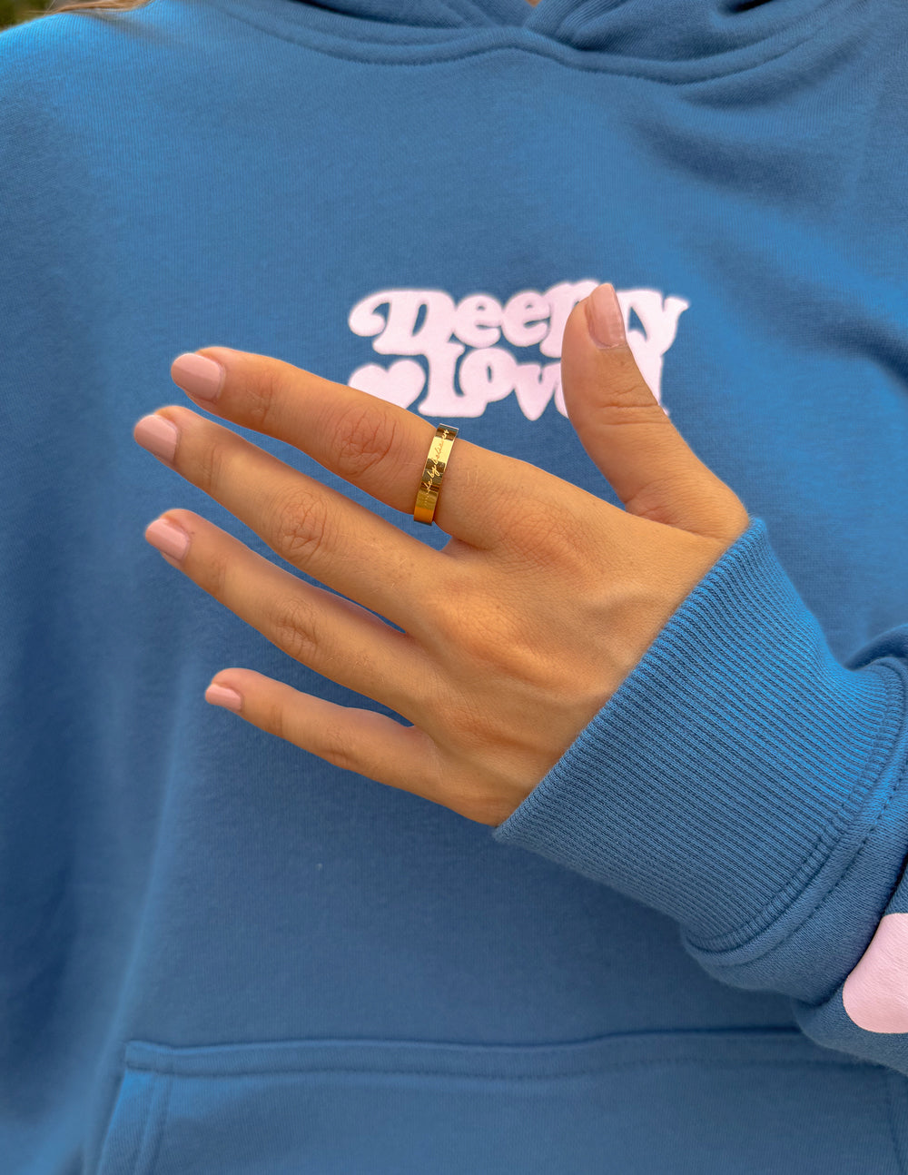 Elevated Faith Made by Believers ring featuring a polished silver band with engraved religious symbols.