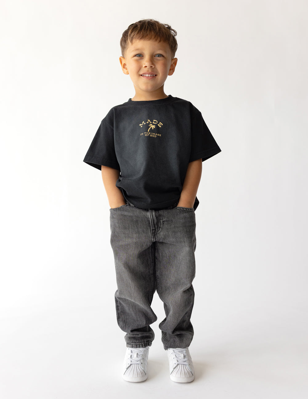 Bright kids' T-shirt from Elevated Faith with "Made in the Image of God" print, featuring colorful and playful design for children.