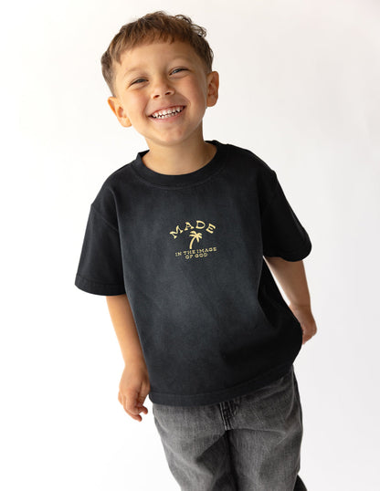 Bright kids' T-shirt from Elevated Faith featuring a colorful "Made in the Image of God" design, perfect for children.