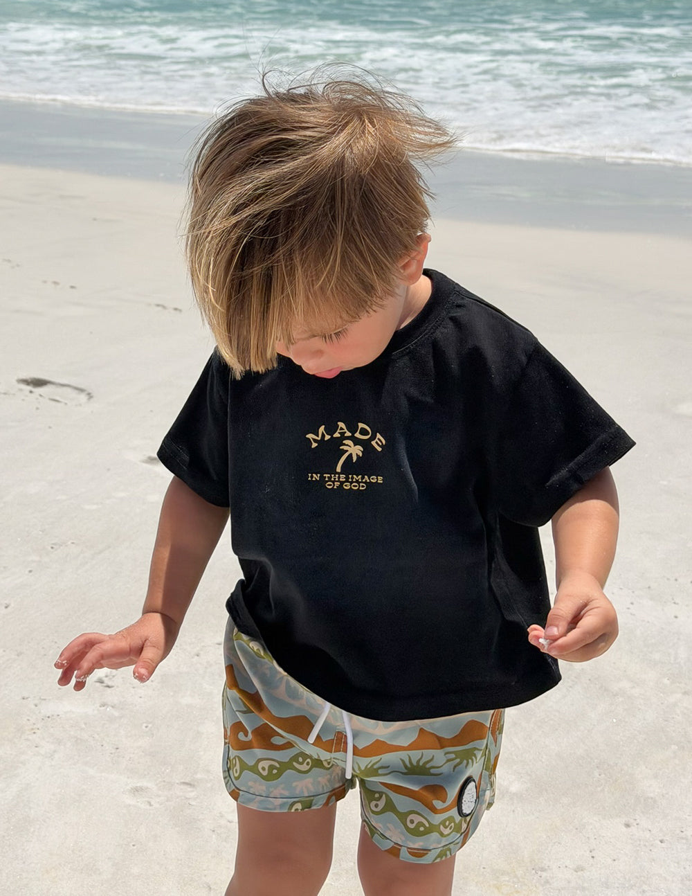 Bright kids' T-shirt by Elevated Faith featuring the "Made in the Image of God" design, colorful and suitable for children.
