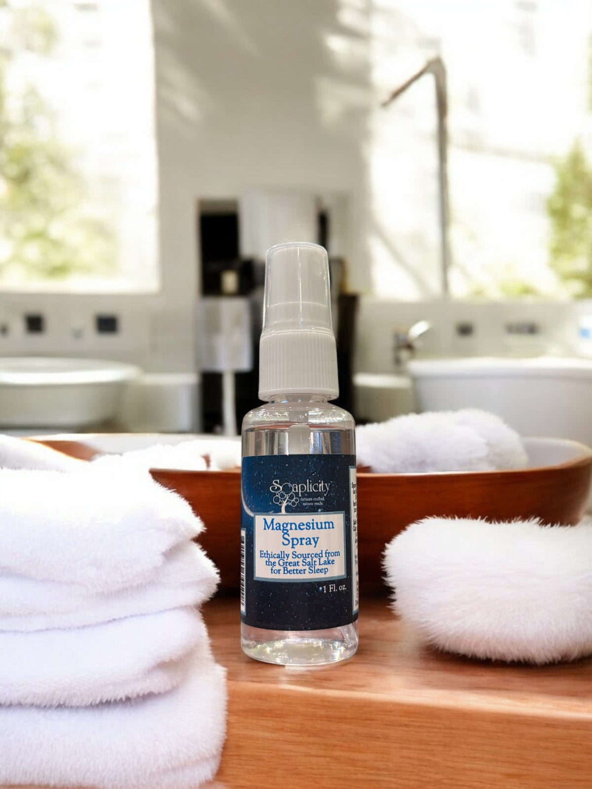 Soaplicity magnesium oil spray in a bottle, used as a natural sleep aid and muscle recovery remedy.