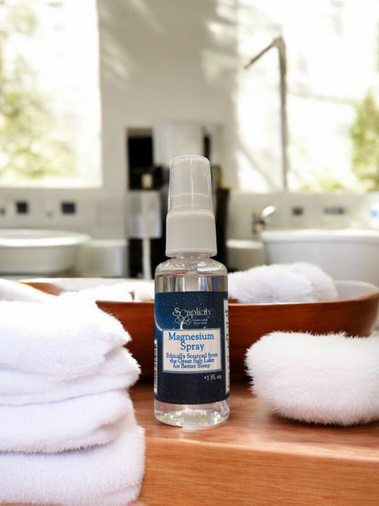 Soaplicity magnesium oil spray in a bottle, used as a natural sleep aid and muscle recovery remedy.
