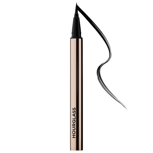 Beauty Care Bag Hourglass Voyeur waterproof liquid eyeliner with precision tip in ultra-black, cruelty-free, long-lasting wear.