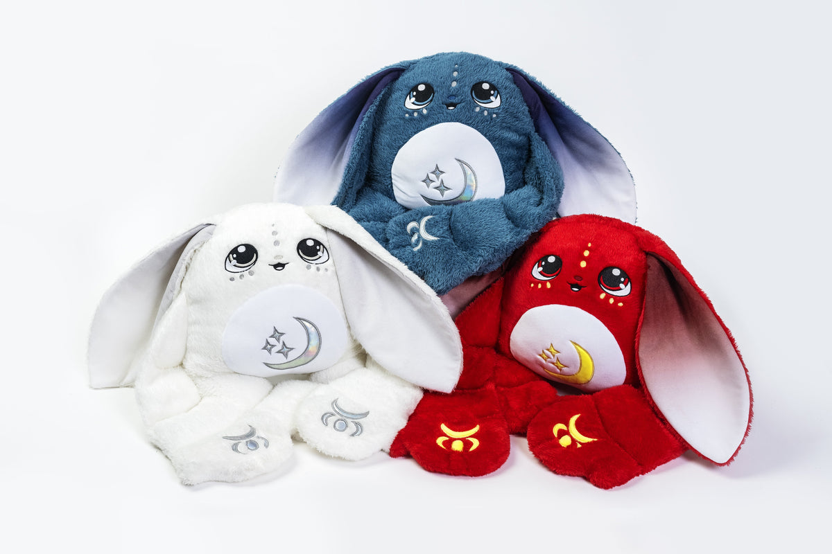 Group of Moon Pals Orion 5lb Hugger Plush toys, soft and cuddly stuffed animals with moon and star designs.
