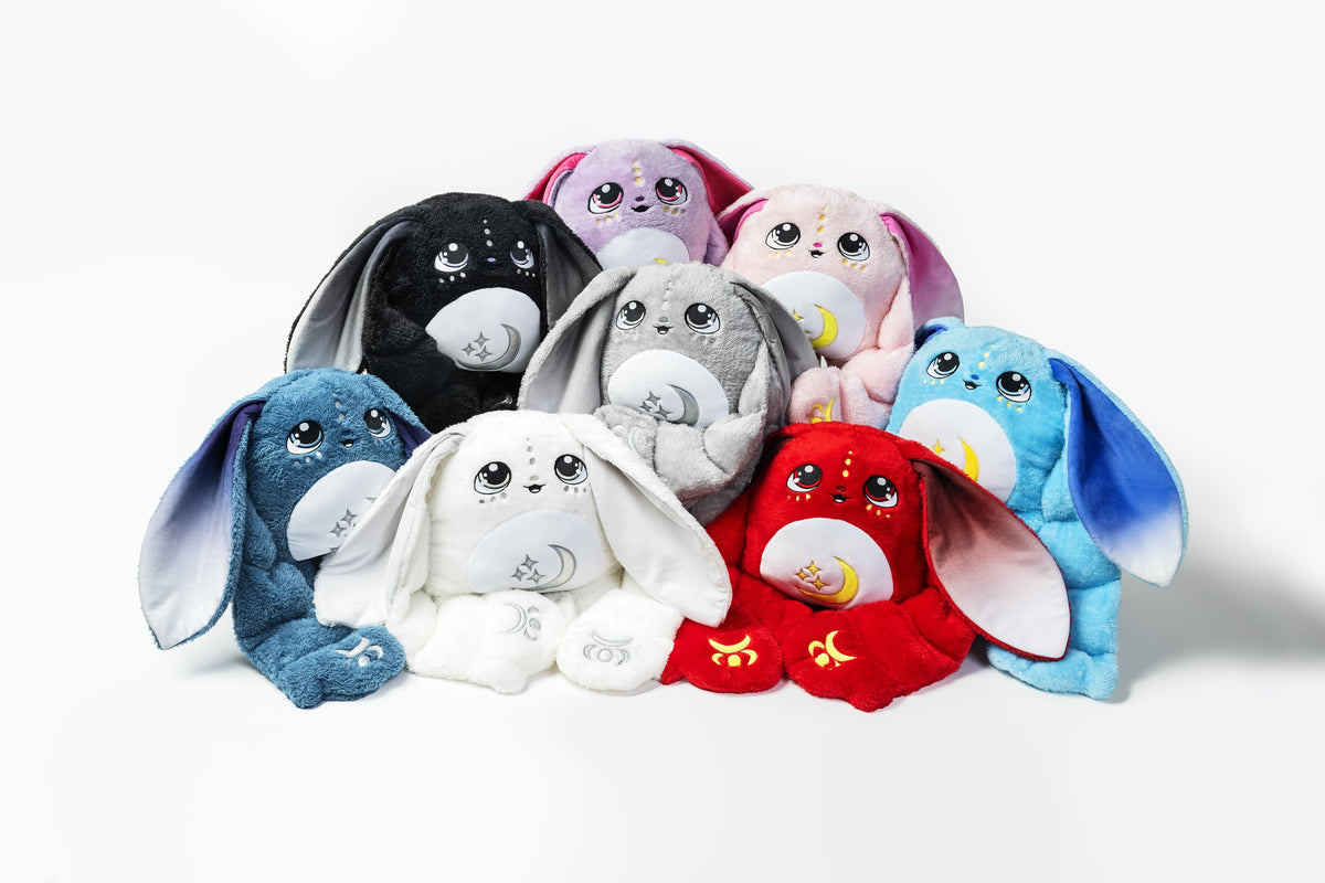 Group of Moon Pals Orion 5lb Hugger Plush toys, soft and cuddly plush animals in various colors, designed for comfort and play.