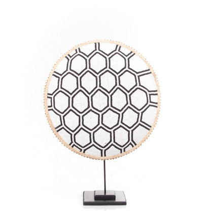 Beaded Cameroon shield with black and white hexagon light design on stand, decorative home decor piece by Luangisa.