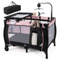 Pink baby playpen with changing table and bassinet, featuring safety rails and soft padding for infants and toddlers.
