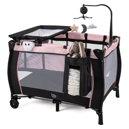 Pink baby playpen with changing table and bassinet, featuring soft sides and a sturdy frame for safe infant play and resting.