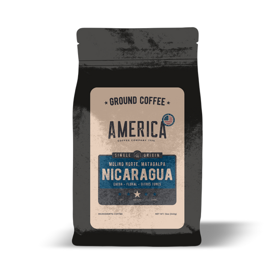 Ground Nicaragua single origin coffee from America Supply Company LLC, showing a bag of freshly ground coffee beans.