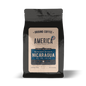 Ground Nicaragua single origin coffee from America Supply Company LLC, showing a bag of freshly ground coffee beans.