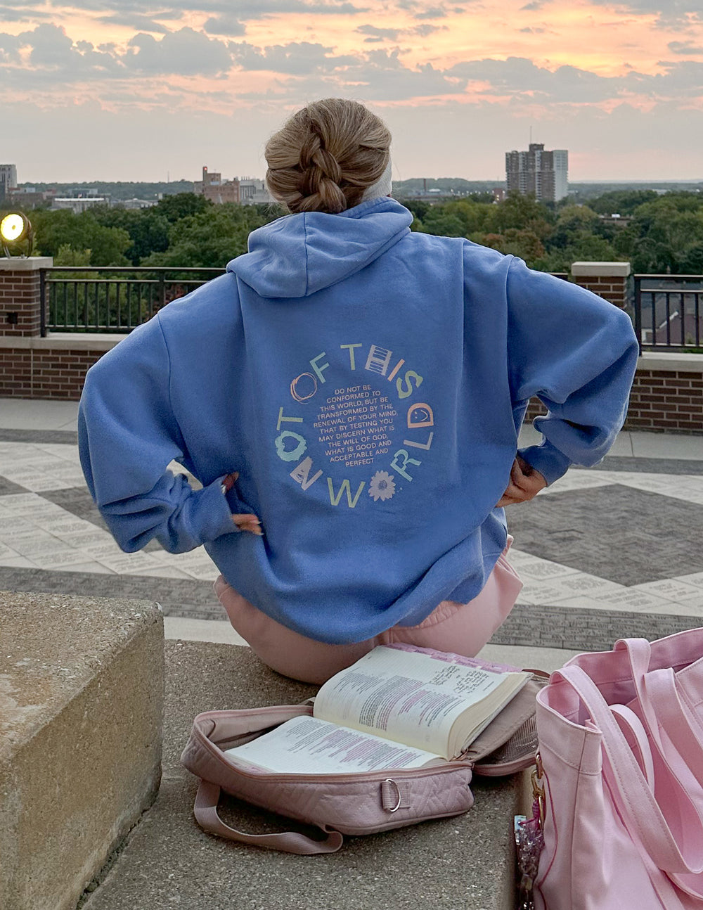 Elevated Faith unisex hoodie featuring a cosmic-inspired "Not of This World" design, shown in a front view with soft fabric texture.