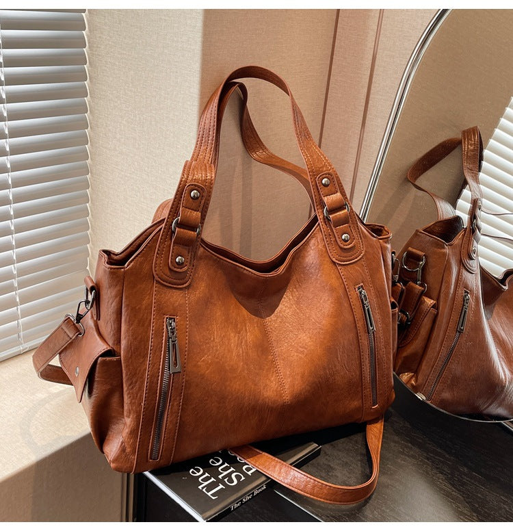 Large capacity CD single-shoulder crossbody tote bag for women, stylish commuter handbag with spacious interior.