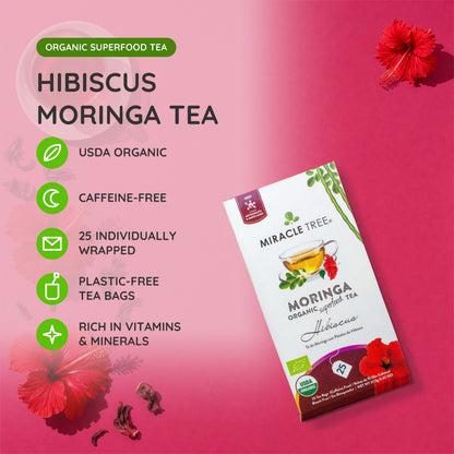 Organic Moringa and hibiscus herbal tea by Miracle Tree in a teacup, showcasing vibrant dried herbs and tea bags.