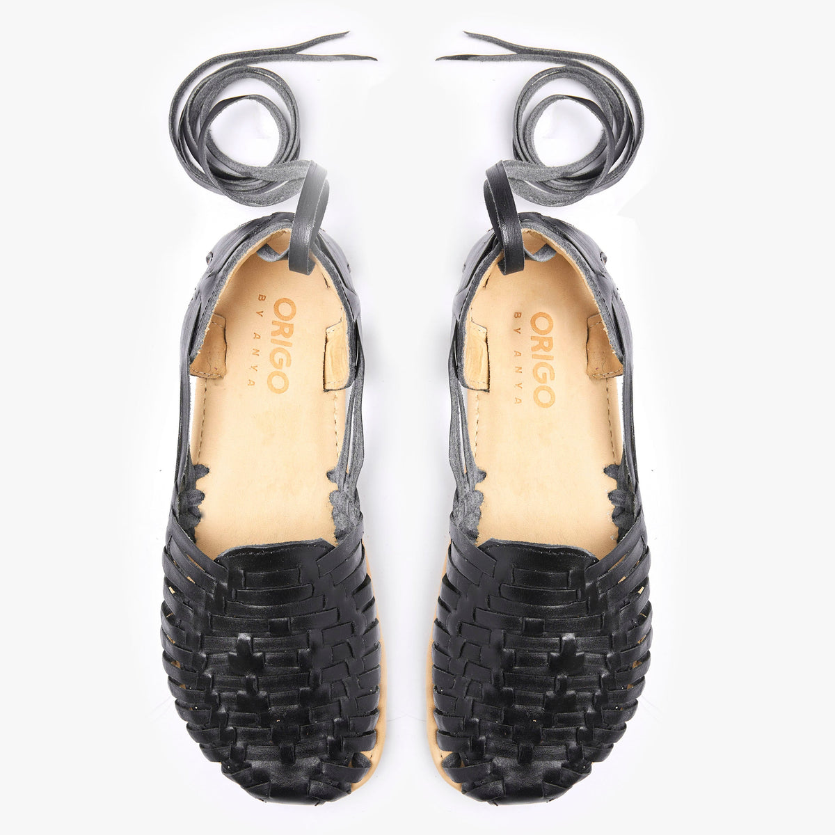 Origo Shoes Las Huarache Slip-On in neutral tones, casual barefoot-inspired sandals with woven straps and open toe design.