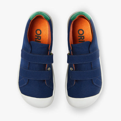 Blue cotton canvas barefoot shoes for kids by Origo Shoes featuring hook and loop straps for easy wear.