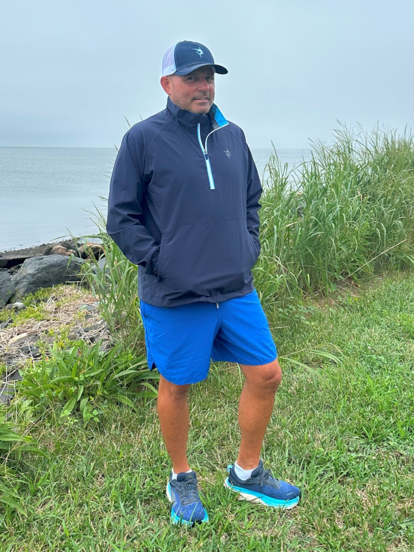 White Water Life Palm Beach waterproof quarter zip sweatshirt shown in blue, featuring a quarter-zip collar and waterproof fabric.