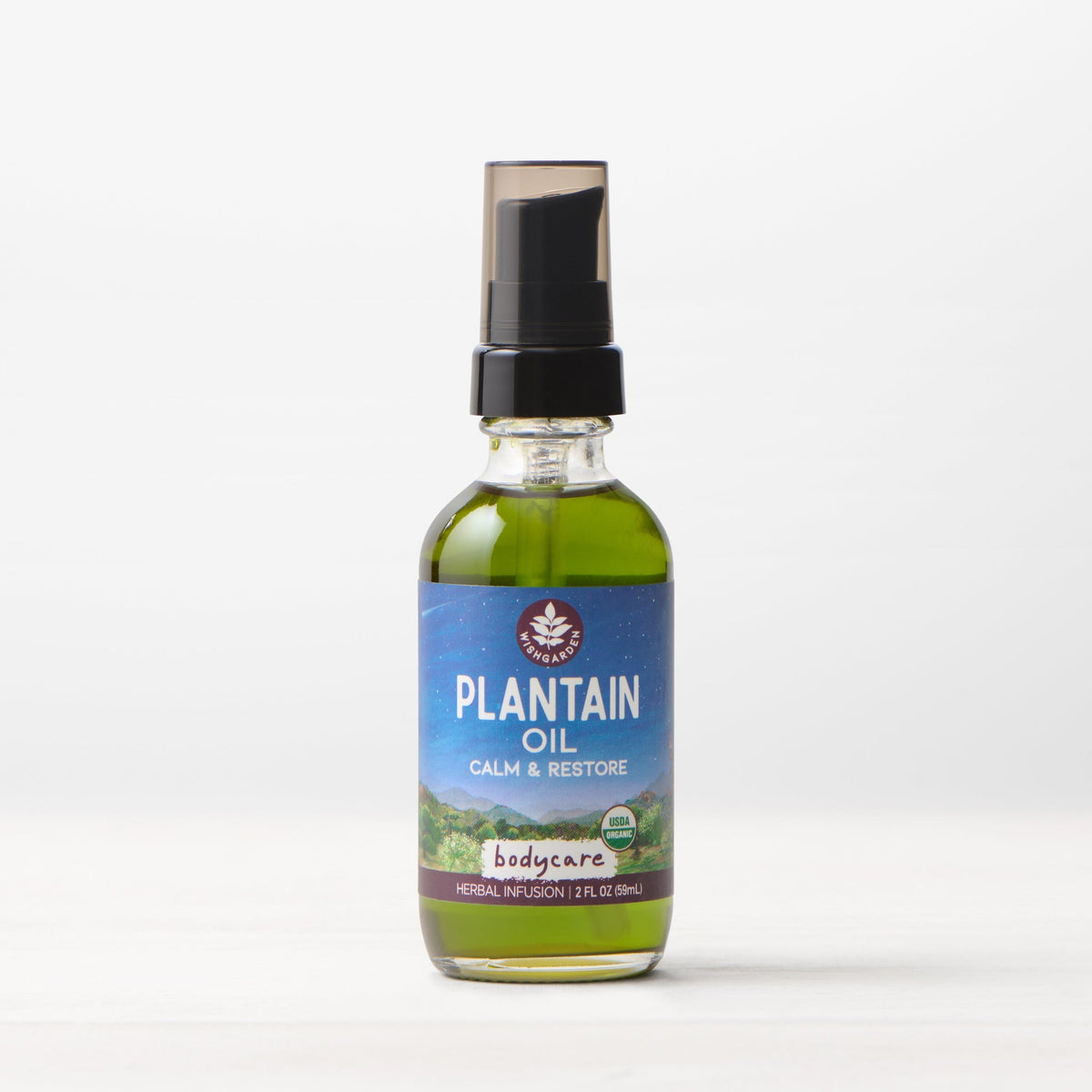 Bottle of WishGarden Herbs Plantain Oil for body care, with plantain leaves and natural ingredients visible in the background.