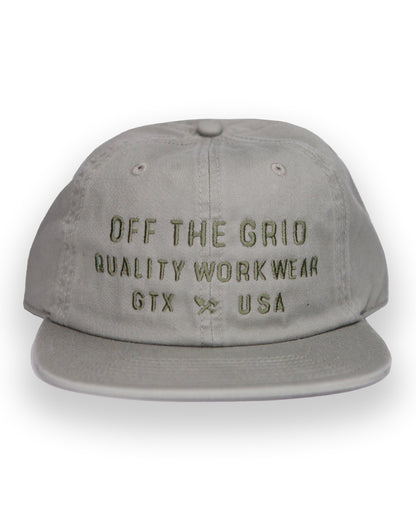 Off The Grid Surplus plated hat in eucalyptus color, featuring a stylish and durable hat design with a metal plated finish.