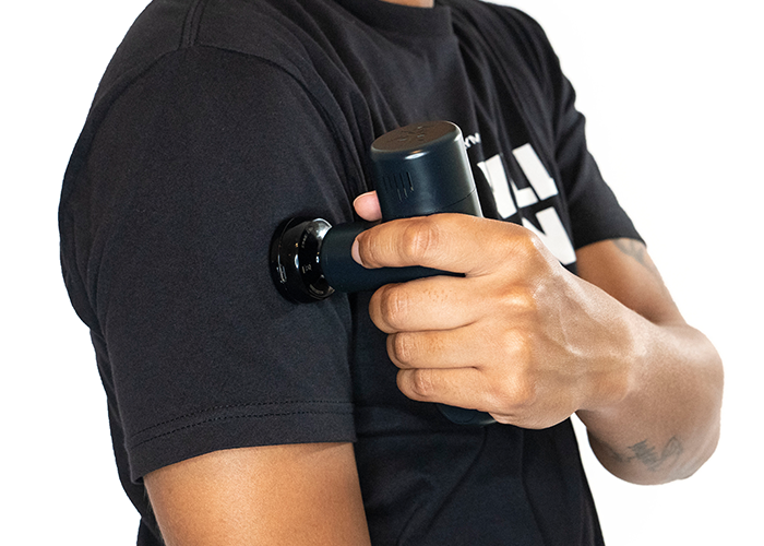 iReliev MVPmini HeatTip massage head attached to percussion massager for targeted muscle relief and soothing therapy.