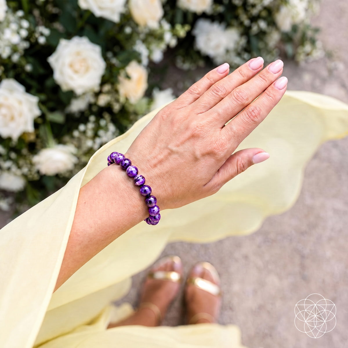 Siberian Charoite bracelet from Conscious Items, featuring polished purple stones on a string, showcasing its unique gemstones.