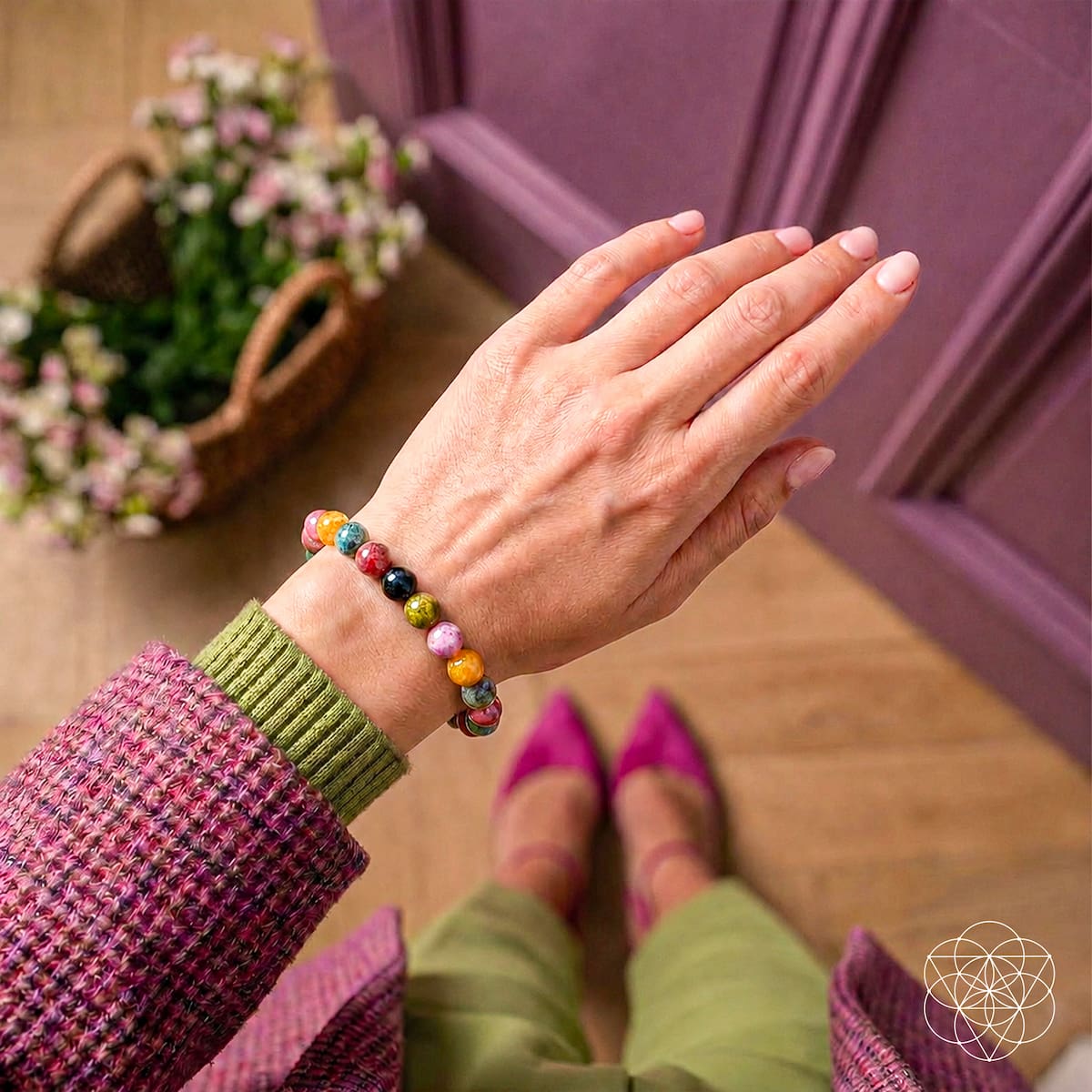 Rainbow tourmaline bracelet by Conscious Items featuring colorful spiral-shaped beads on a stretch elastic band.
