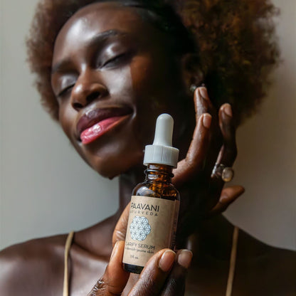 Paavani Ayurveda Clarify Serum in a glass bottle with dropper, Ayurvedic face oil for blemish-prone skin on a neutral background