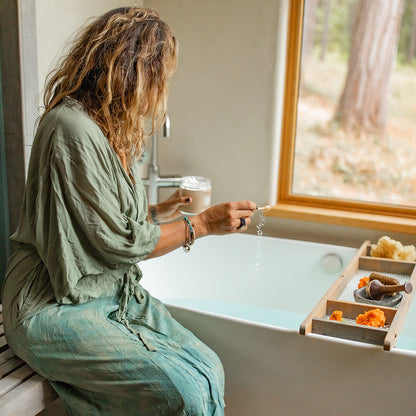 A simple image of a coconut milk bath in a relaxing setting, emphasizing Ayurvedic herbal ingredients for skin and spirit wellness.