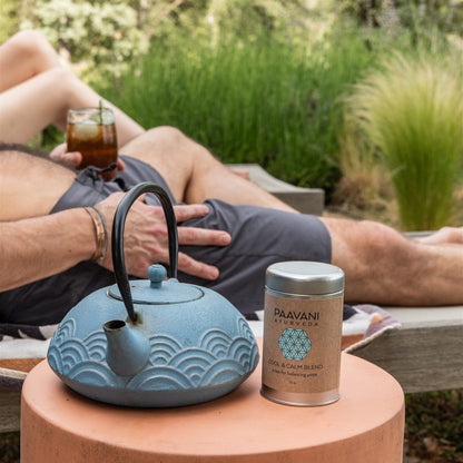 Ayurvedic tea bottle labeled Cool & Calm Blend by Paavani Ayurveda, featuring herbal ingredients for Pitta balance.