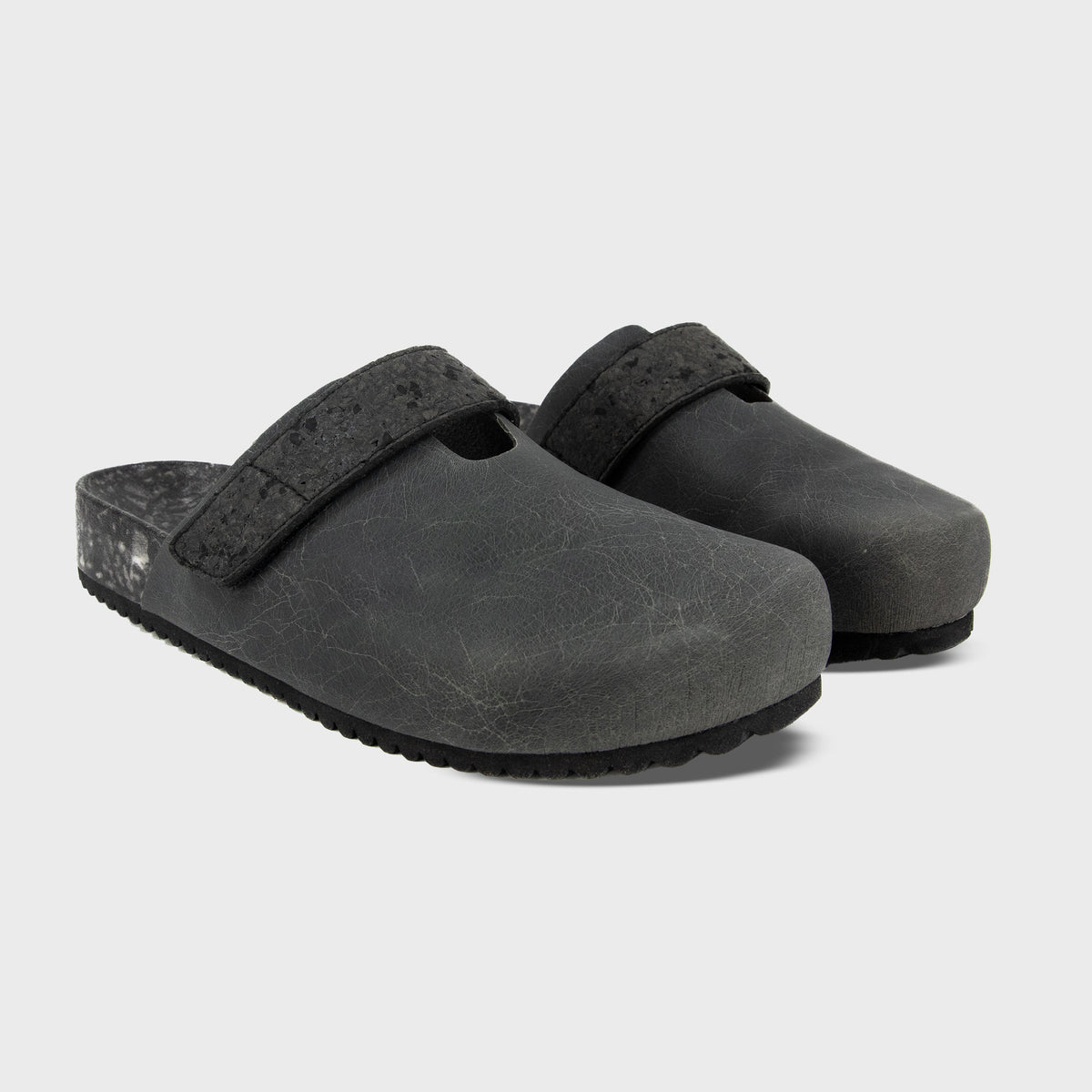 Pair of Fleks More Mesa Clogs in After Dark color, featuring a stylish slip-on design and durable construction.