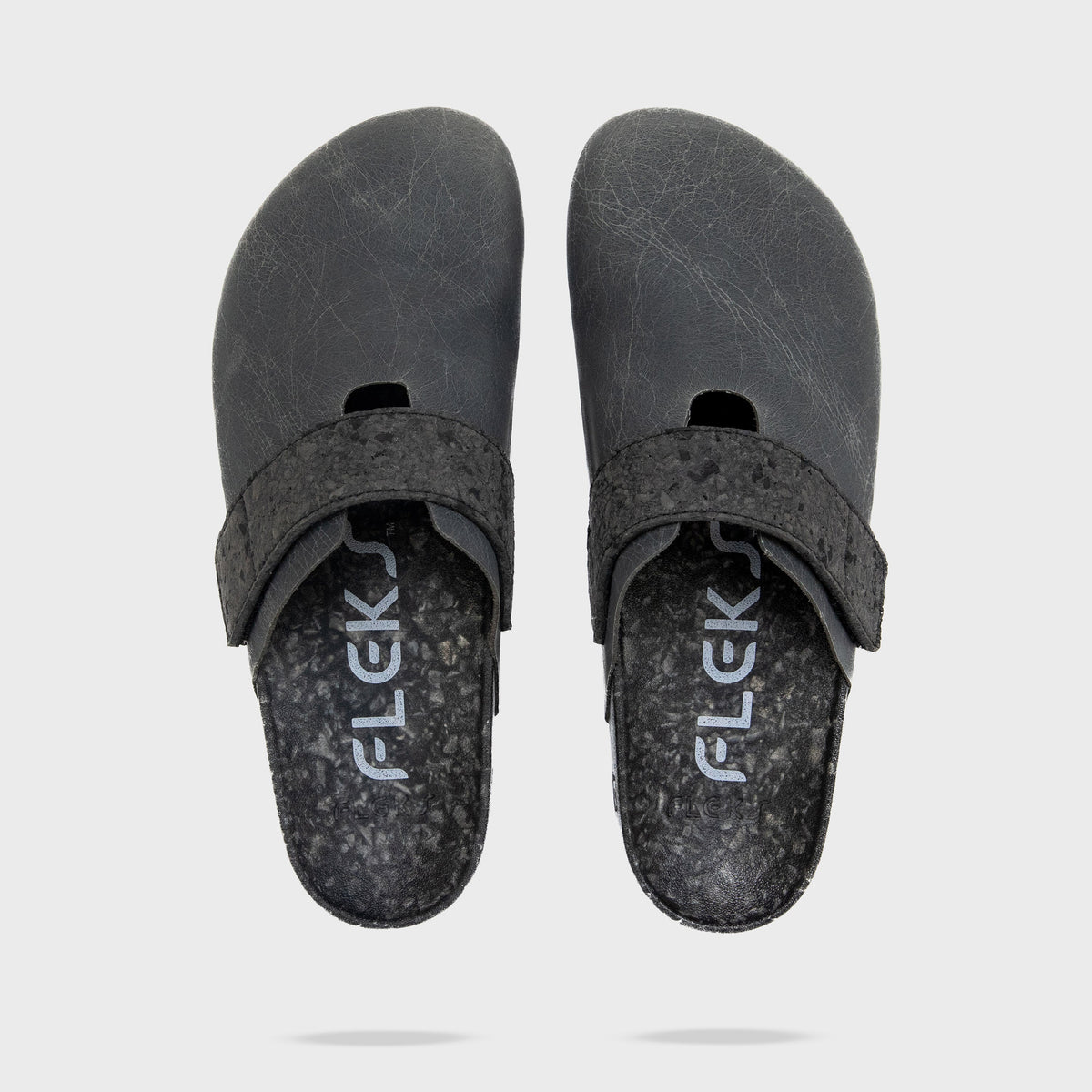 Fleks More Mesa Clog in After Dark, shown from top, side, and shadow angles, featuring a stylish slip-on design and textured surface.