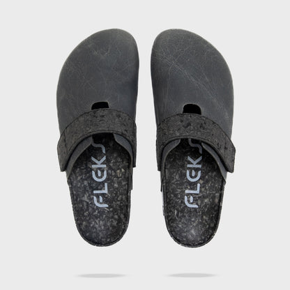 Fleks More Mesa Clog in After Dark, shown from top, side, and shadow angles, featuring a stylish slip-on design and textured surface.