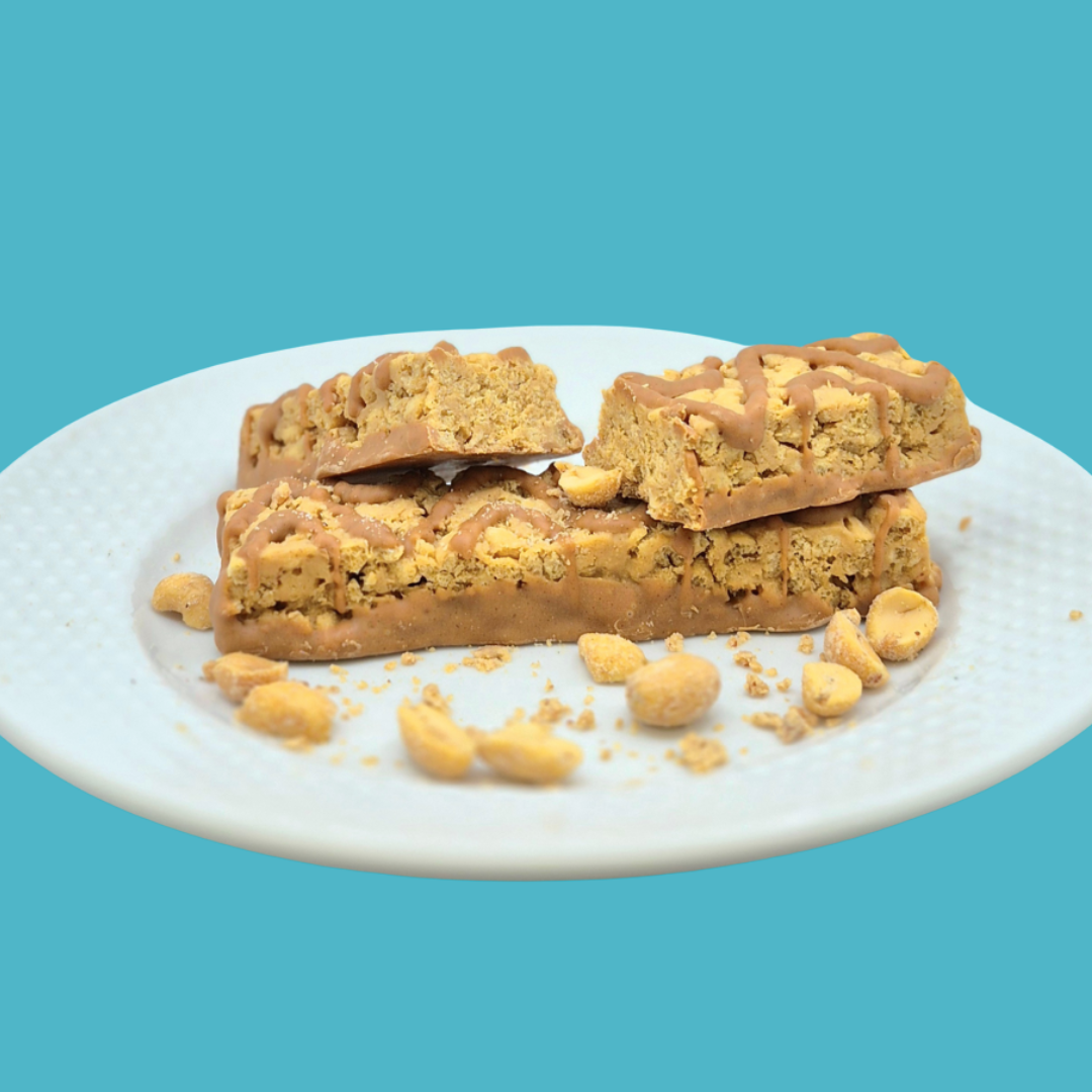 Peanut Surprise Bar by AmBari Nutrition, ProtiDiet, showing a protein bar with peanut chunks and chocolate coating.