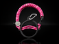 Pink paracord handle accessory by Coldest with diamond pattern on a black background.