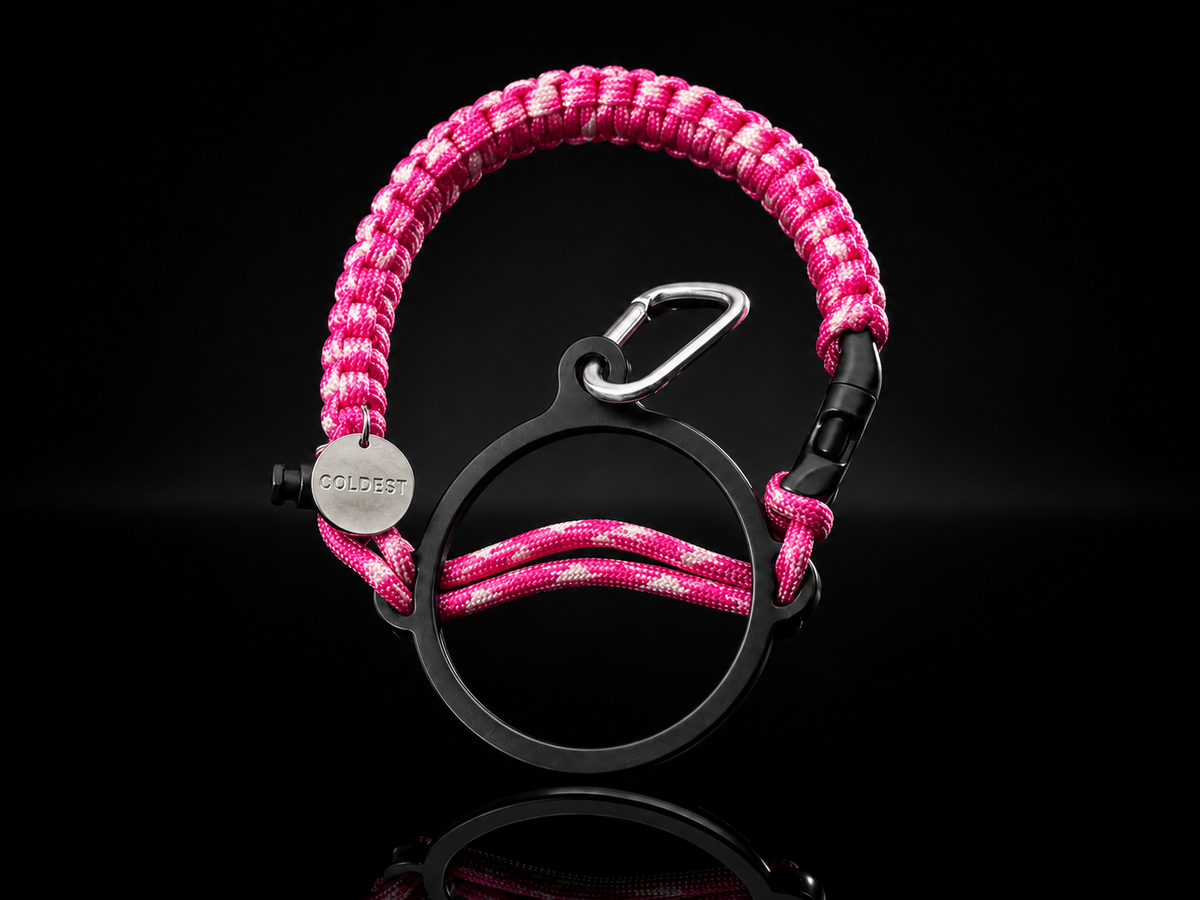 Pink Diamonds Coldest Paracord Handle accessory with black background, featuring a vibrant pink diamond design.