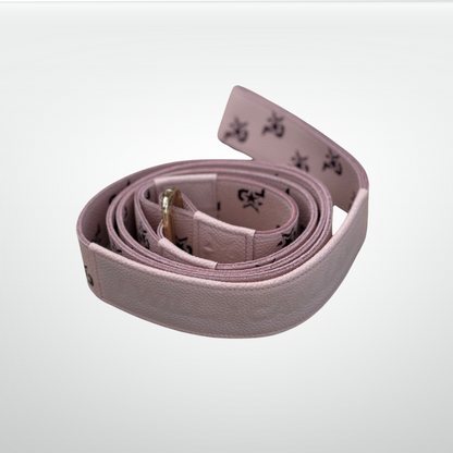 Pink leather I AM Monogram Yoga Strap by iReliev, luxury fitness accessory for stretching and yoga practice.
