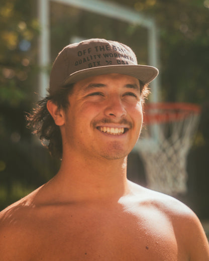Off The Grid Surplus plated hat in walnut color, featuring a stylish and durable hat design with a sleek finish.