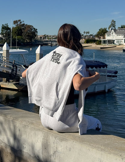 Elevated Faith Pray First unisex hoodie featuring a comfortable design with prayer-themed graphics on the front.