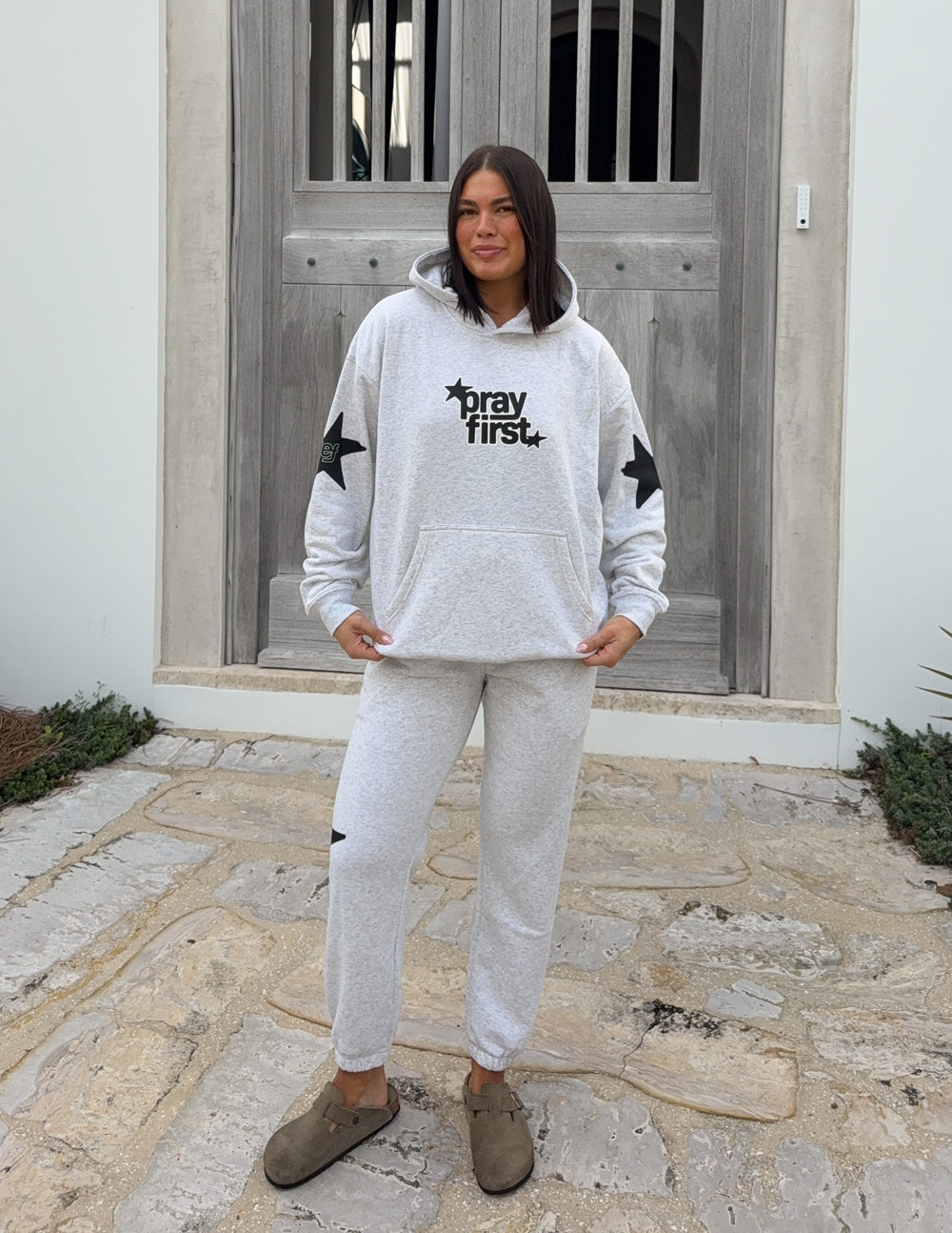 Unisex Pray First hoodie by Elevated Faith featuring a comfortable fit and bold prayer-themed graphic design.