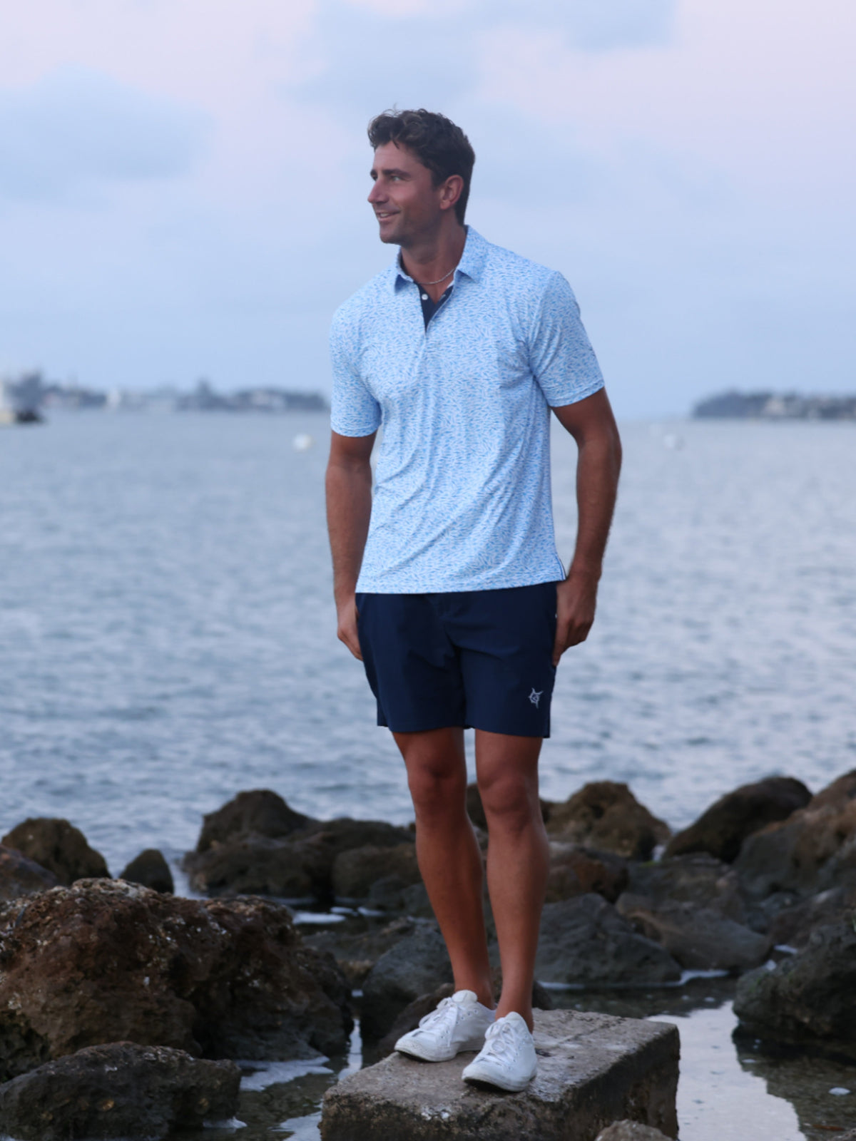 White Water Life Predator print polo shirt featuring a bold predator graphic on the front, short sleeves, and classic polo collar.