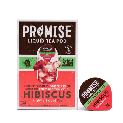 Java House Promise Real Brewed Hibiscus Tea in a clear glass bottle with fresh hibiscus flowers and tea leaves visible.
